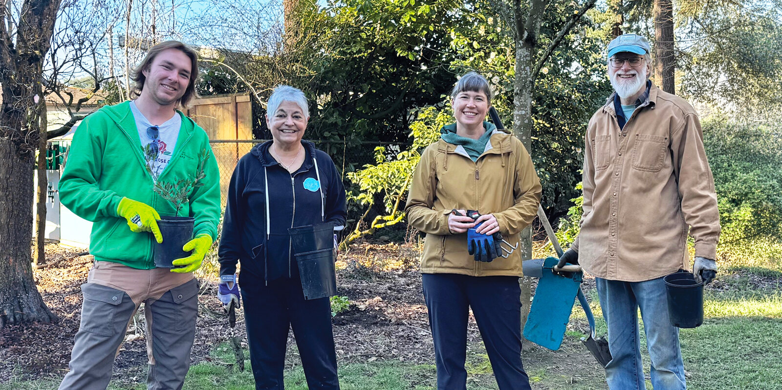 Volunteers with buckets and shovels at a Wilshire Park planting
