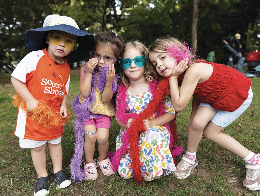 Light & Lens Images set up a photo booth at the block party, attracting hordes of enthusiastic children looking to "glam it up" with the props provided.